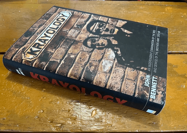Limited edition hardback KRAYOLOGY, signed by author John Bennett and signature of Nipper Read on a photo of the Krays